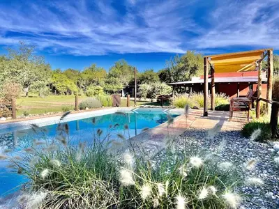 a swimming pool in the middle of a yard at Cielos Abiertos in La Paz