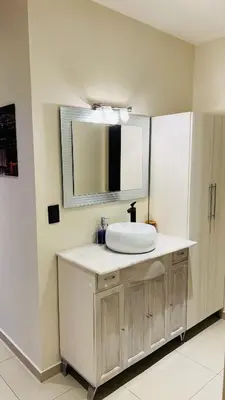a bathroom with a sink and a mirror at Atlantico in Cordoba