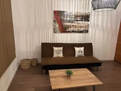 a living room with a couch and a table at Depto 23 en Barrio Villa Belgrano excelente ubicación in Cordoba