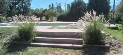 a set of concrete steps leading to a pool with avisorvisor at Cardozo House, casa de campo in Villa Dolores