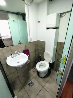 a bathroom with a toilet and a sink at Duplex-Loft in Cordoba