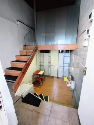 a view of a staircase in a room with a table at Duplex-Loft in Cordoba