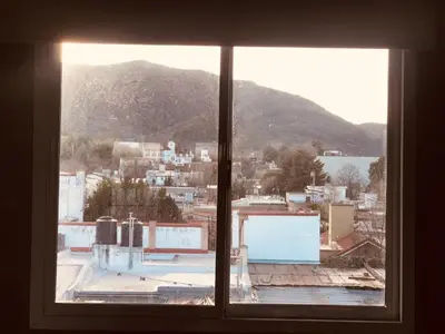 a view of a city from a window at Departamento pleno centro costanera estilo industrial único in Santa Rosa de Calamuchita